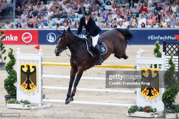 Jens Hilbert rides on Guess during the Balve Optimum International Horse Show on June 8, 2018 in Balve, Germany.