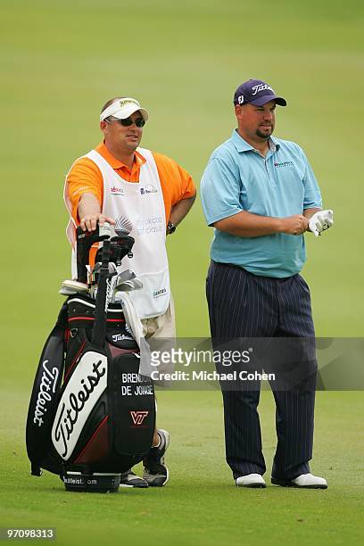 Brendon de Jonge of Zimbabwe stands next to his caddie during the final round of the Mayakoba Golf Classic at El Camaleon Golf Club held on February...