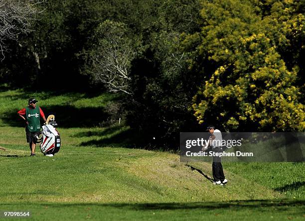 Andres Romero of Argentina hits from off the fairway on the 13th hole during the final round of the Northern Trust Open at Riviera Country Club on...