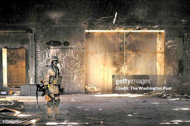 Baghdad Site Survey Team 3 searches an abandoned warehouse in Baghdad for WMDs. They found nothing.