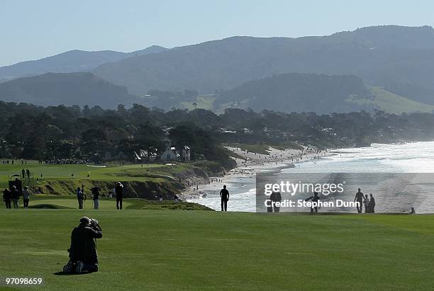Photographer lines up a shot on the ninth hole during the final round of the AT&T Pebble Beach National Pro-Am at Pebble Beach Golf Links on February...