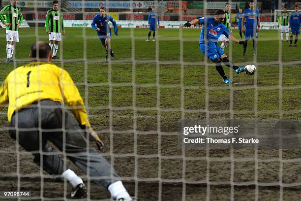 Mahir Saglik of Paderborn scores via penalty against goalkeeper Gabor Kiraly of Munich during the Second Bundesliga match between SC Paderborn and...