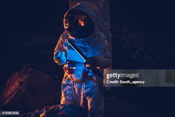 astronaut discovering life - globe costume stock pictures, royalty-free photos & images