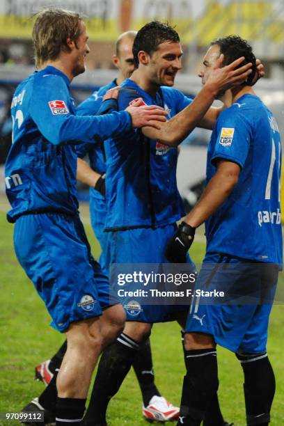 Soeren Brandy, Enis Alushi and Mahir Saglik of Paderborn celebrate their first goal during the Second Bundesliga match between SC Paderborn and 1860...