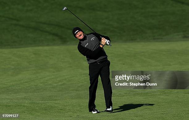 Alex Cejka of Germany watches his second shot on the second hole during the final round of the AT&T Pebble Beach National Pro-Am at Monterey...