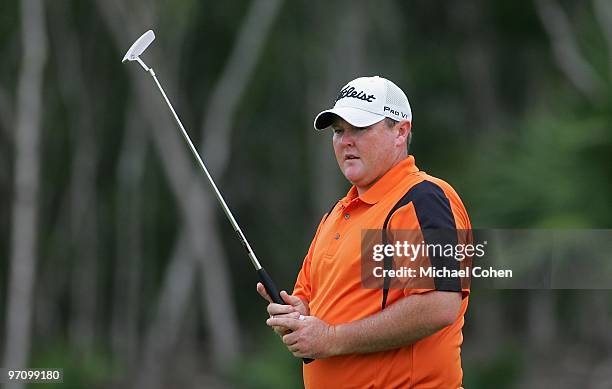 Jarrod Lyle of Australia watches his shot during the second round of the Mayakoba Golf Classic at El Camaleon Golf Club held on February 19, 2010 in...