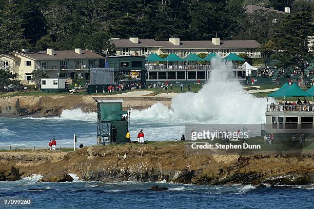 Waves crash along the 18th hole in a view over the 17th green during the final round of the AT&T Pebble Beach National Pro-Am at Pebble Beach Golf...