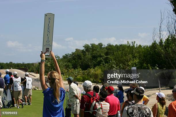 Volunteers hold signs during the third round of the Mayakoba Golf Classic at El Camaleon Golf Club held on February 20, 2010 in Riviera Maya, Mexico.