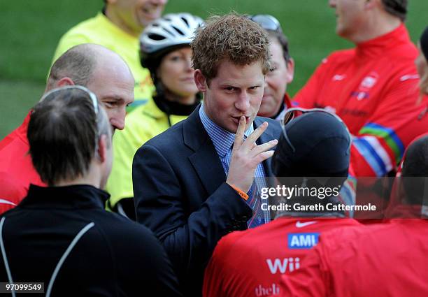 Prince Harry meets former England rugby international Lawrence Dallaglio after Dallaglio and other cyclists taking part in the Dallaglio Cycle Slam...