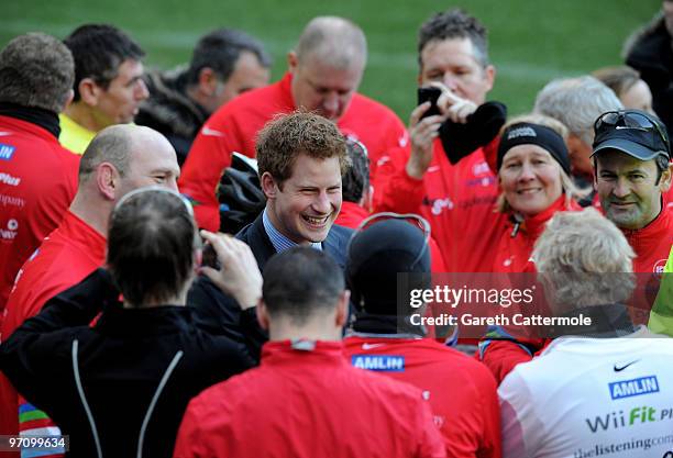 Prince Harry meets former England rugby international Lawrence Dallaglio after Dallaglio and other cyclists taking part in the Dallaglio Cycle Slam...
