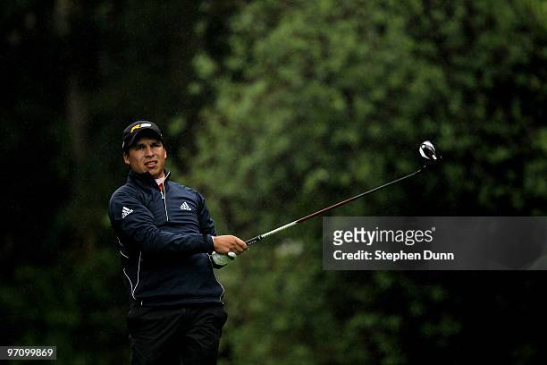 Andres Romero of Argentina hits his tee shot on the 12th hole during the second round of the Northern Trust Open at Riveria Country Club on February...