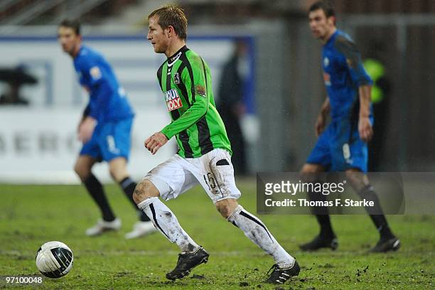 Stefan Aigner of Munich runs with the ball during the Second Bundesliga match between SC Paderborn and 1860 Muenchen at Energieteam Arena on February...