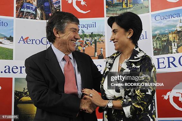 Fabio Villegas , CEO of Avianca, greets Gabriela Sommerfeld, executive president of Ecuadorean airline Aerogal, during a joint news conference in...