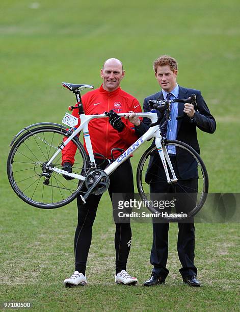 Prince Harry and former England rugby player Lawrence Dallaglio pose at Twickenham Stadium to welcome back cyclists taking part in the Dallaglio...