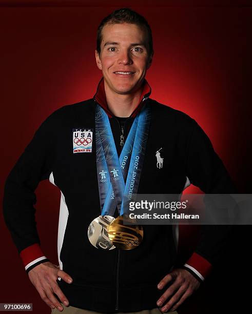 Nordic combined skier Bill Demong of the United States poses with his gold medal for the cross-country individual LH/10 km and silver medal for the...