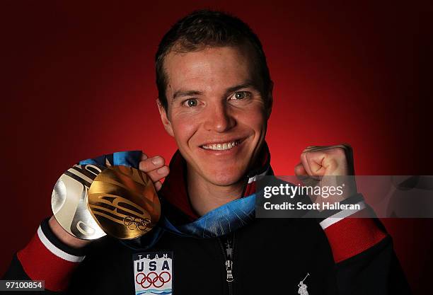 Nordic combined skier Bill Demong of the United States poses with his gold medal for the cross-country individual LH/10 km and silver medal for the...