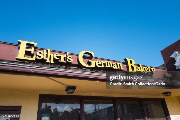 Sign on facade of Esther's German Bakery, a German cuisine restaurant and bakery which is popular among technology workers and is known for being a...