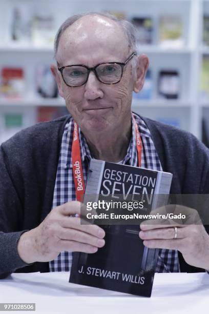 Half length portrait of author J Stewart Willis with his book Gestation 7 during the 2018 edition of BookExpo America in New York City, May 31, 2018.