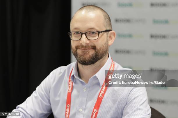 Half length portrait of illustrator Kevin Cornell smiling, New York City, New York, May 31, 2018.
