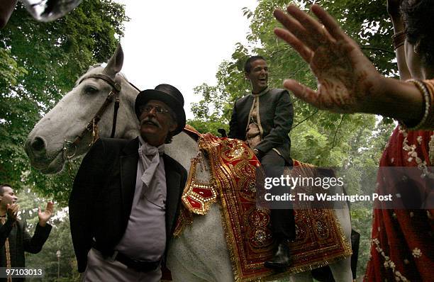 Glenview Mansion, Rockville, MD Groom Vasu Muthyala arrives on a horse for his traditional Hindu matrimonial ceremony to bride Cynthia Gonzalez in...