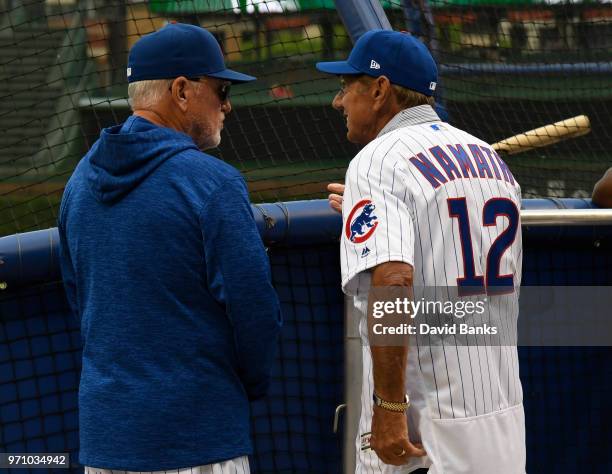 Hall of Fame football player Joe Namath is given a tour of Wrigley Field by Joe Maddon of the Chicago Cubs before the game between the Chicago Cubs...