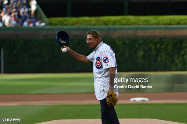Hall of Fame football player Joe Namath throws out a ceremonial first pitch before the game between the Chicago Cubs and the Philadelphia Phillies on...