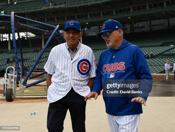 Hall of Fame football player Joe Namath is given a tour of Wrigley Field by Joe Maddon of the Chicago Cubs before the game between the Chicago Cubs...