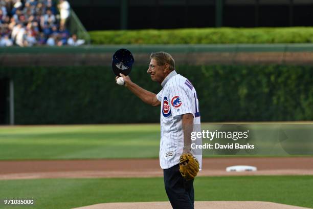 Hall of Fame football player Joe Namath throws out a ceremonial first pitch before the game between the Chicago Cubs and the Philadelphia Phillies on...