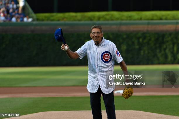 Hall of Fame football player Joe Namath throws out a ceremonial first pitch before the game between the Chicago Cubs and the Philadelphia Phillies on...