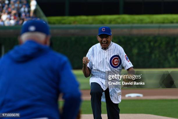 Hall of Fame football player Joe Namath throws out a ceremonial first pitch before the game between the Chicago Cubs and the Philadelphia Phillies on...