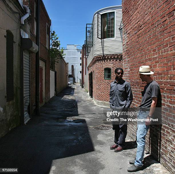 7th St,, NE, Washington, D.C., Photographer Steven M. Cummings chats with David Bernhardt outside their alley dwellings in northeast Washington, D.C....