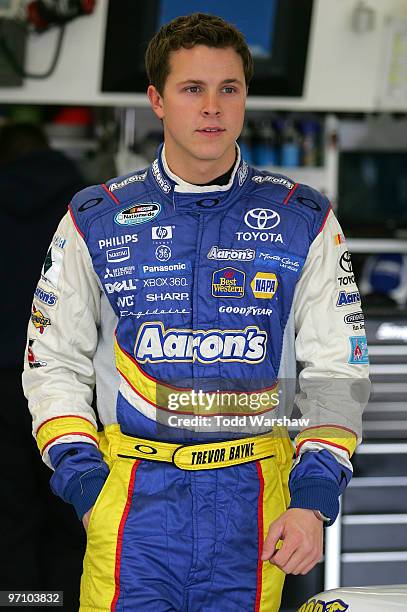 Trevor Bayne, driver of the Aaron's Dream Machine Toyota, stands in the garage during practice for the NASCAR Nationwide Series Sam's Town 300 at Las...