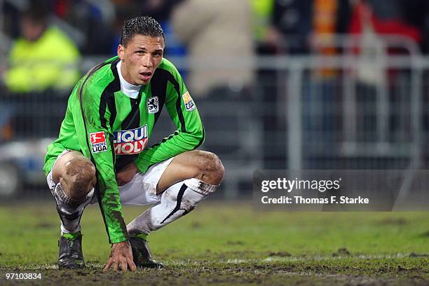 Jose Holebas of Munich sits on the pitch dejected after the Second Bundesliga match between SC Paderborn and 1860 Muenchen at Energieteam Arena on...