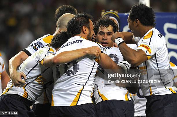 South Africa 'Brumbies team congratulates Brumbies flank George Smith after scoring a try on February 26, 2010 during the Super14 rugby match between...