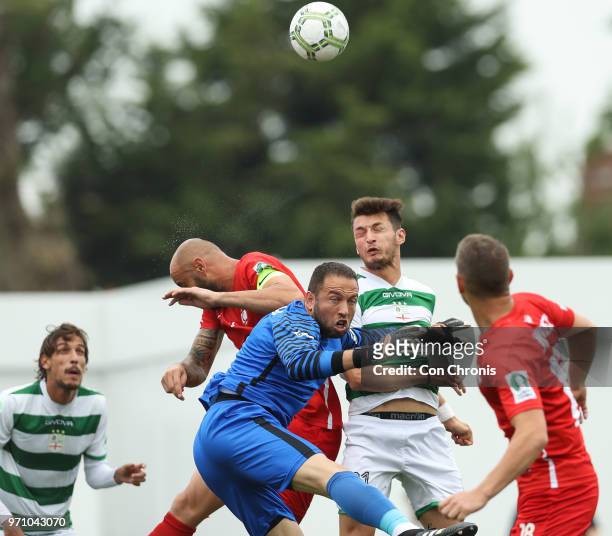 Goalkeeper Hasan Piro of Northern Cyprus and Riccardo Ravasi of Padania clash as the compete for the ball during the CONIFA World Football Cup 2018...