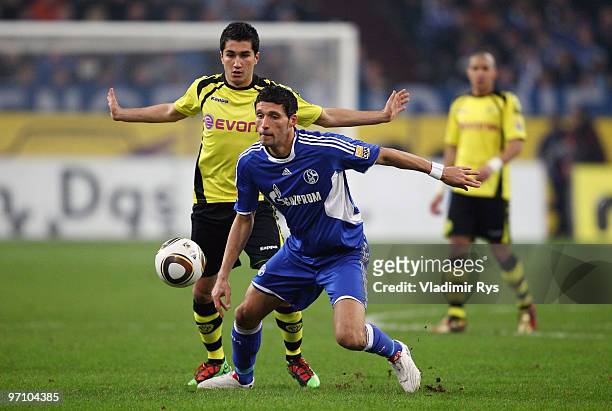 Kevin Kuranyi of Schalke and Nuri Sahin of Dortmund battle for the ball during the Bundesliga match between FC Schalke 04 and Borussia Dortmund at...