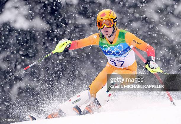 Canada's Erin Mielzynski clears a gate during the Women's Vancouver 2010 Winter Olympics Slalom event at Whistler Creek side Alpine skiing venue on...