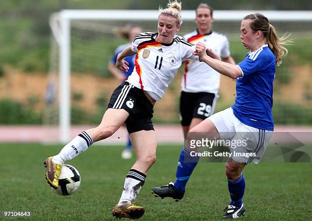 Anja Mittag of Germany and Elina Syryala of Finland battle for the ball during the Woman's Algarve Cup match between Germany and Finland at the...