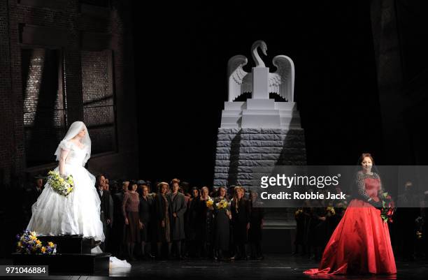 Jennifer Davis as Elsa von Brabant and Christine Goerke as Ortrud with artists of the company in Richard Wagner's Lohengrin directed by David Alden...