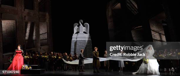 Christine Goerke as Ortrud and Jennifer Davis as Elsa von Brabant with artists of the company in Richard Wagner's Lohengrin directed by David Alden...