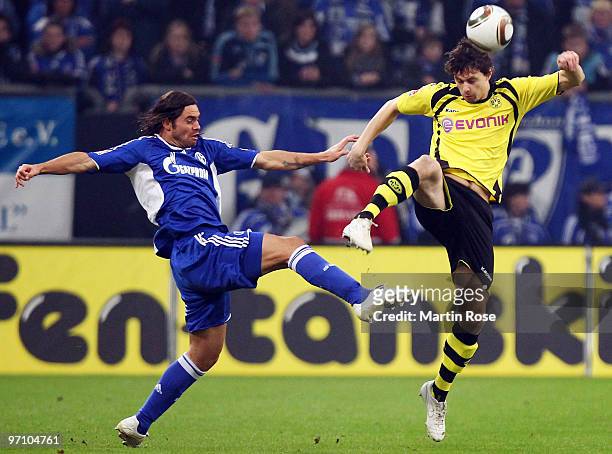 Edu of Schalke and Neven Subotic of Dortmund battle for the ball during the Bundesliga match between FC Schalke 04 and Borussia Dortmund at the...