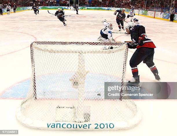 Ryan Malone of the United States scores past Goalkeeper Miikka Kiprusoff of Finland during the ice hockey men's semifinal game between the United...