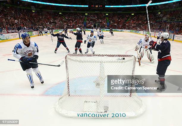 Ryan Malone of the United States celebrates after he scored past goalkeeper Miikka Kiprusoff of Finland during the ice hockey men's semifinal game...