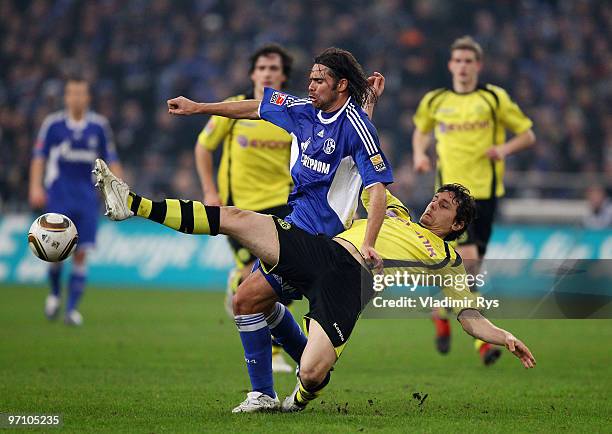 Eduardo Goncalves of Schalke and Neven Subotic of Dortmund battle for the ball during the Bundesliga match between FC Schalke 04 and Borussia...