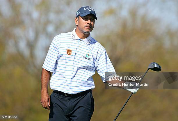 Jeev Milkha Singh of India watches his tee shot on the ninth hole during the second round of the Waste Management Phoenix Open at TPC Scottsdale on...