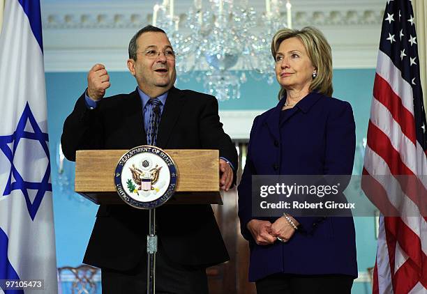 Israeli Defense Minister Ehud Barak speaks to the media as U.S. Secretary of State Hillary Clinton stand by on February 26, 2010 in Washington, DC....