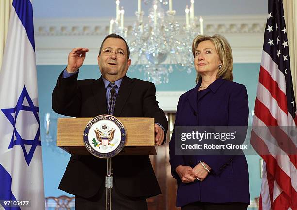 Israeli Defense Minister Ehud Barak speaks to the media as U.S. Secretary of State Hillary Clinton stand by on February 26, 2010 in Washington, DC....