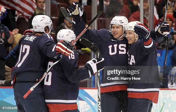 Erik Johnson of the United States celebrates after he scored during the ice hockey men's semifinal game between the United States and Finland on day...