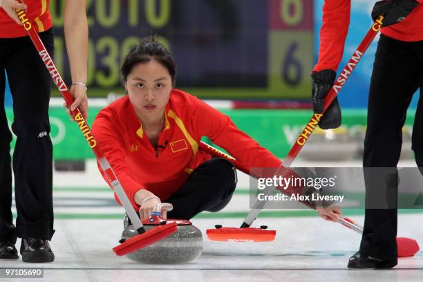 Qingshuang Yue of China releases the stone during the women's bronze medal curling game between China and Switzerland on day 15 of the Vancouver 2010...