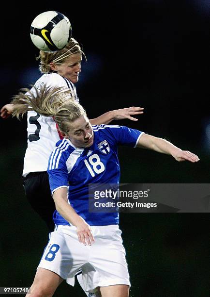 Saskia Bartusiak of Germany and Linda Sallstrom of Finland jump for a header during the Woman's Algarve Cup match between Germany and Finland at the...